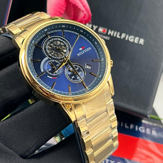 Montre Tommy Hilfiger (Ref MM039 Bracelet Acier inoxydable doré)